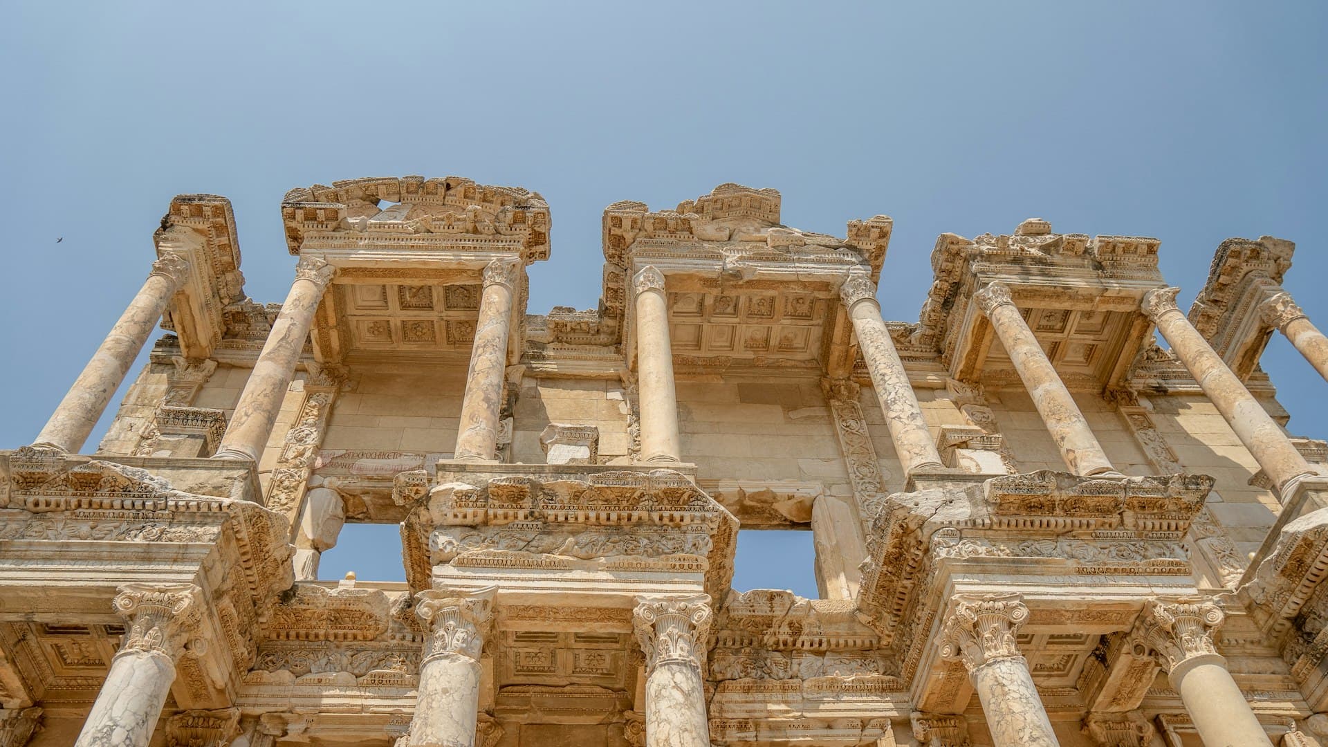 The Library of Celsus at Ephesus with visitors standing among the ancient columns
