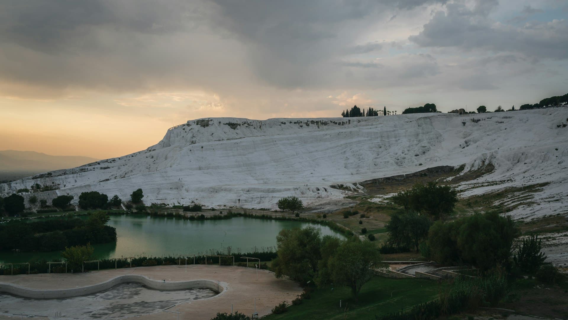 The white travertine terraces of Pamukkale filled with turquoise thermal water